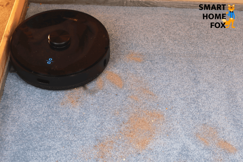Proscenic M7 Pro vacuums sand during the suction review on a long pile carpet